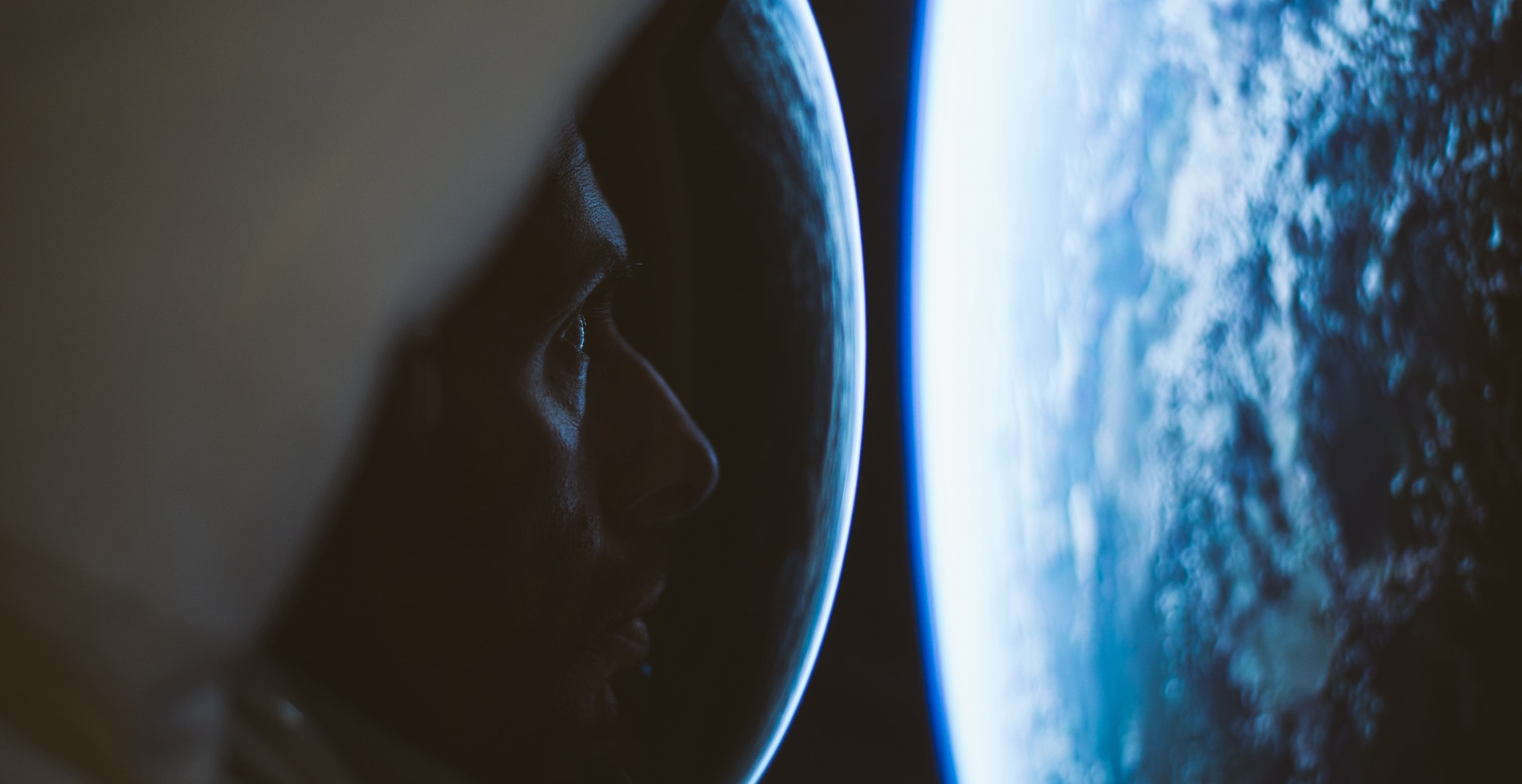 astronaut looking at earth from space