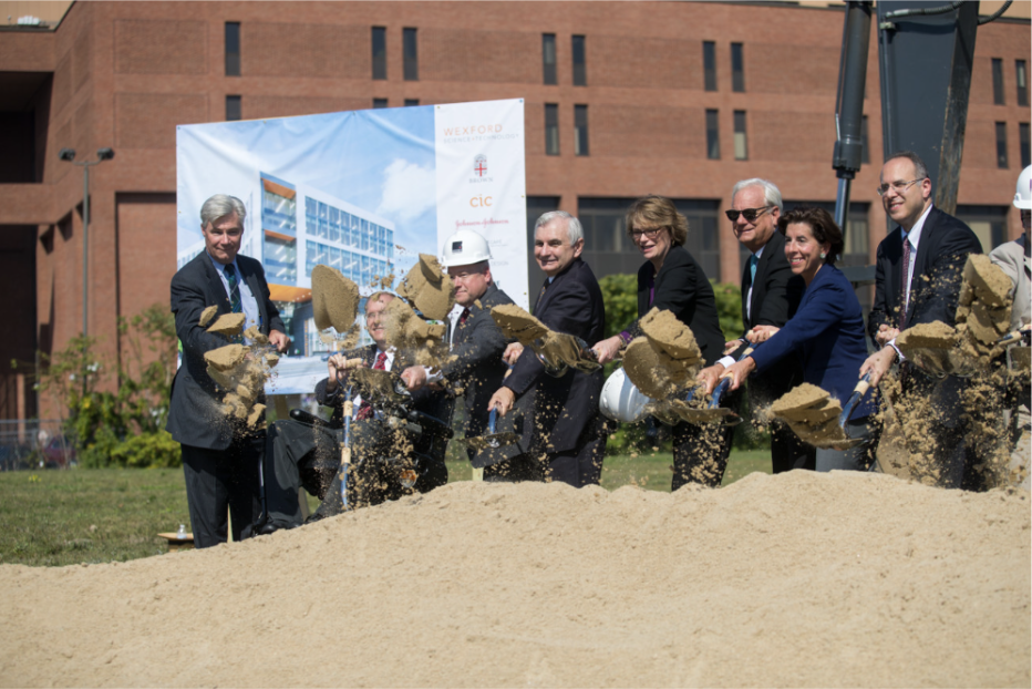 photo of people breaking ground with shovels at 225 Dyer