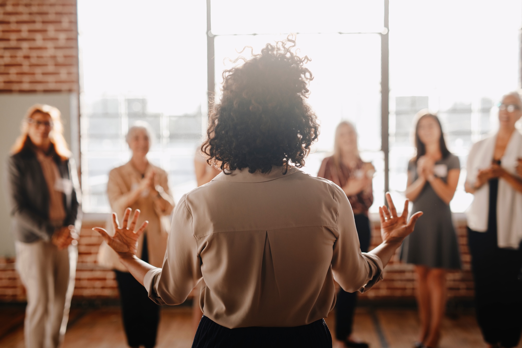 female empowering other colleagues in workplace