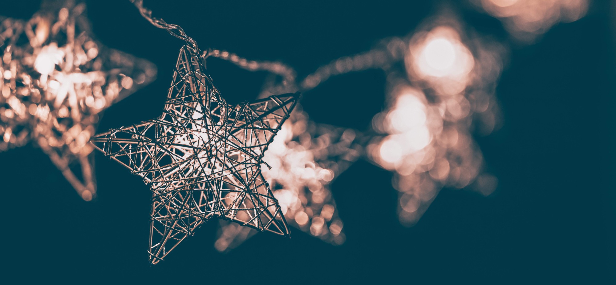 image of star string lights twinkling at night