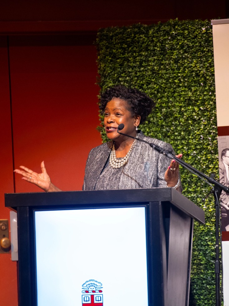 Sylvia Carey-Butler speaks on podium at Brown University.