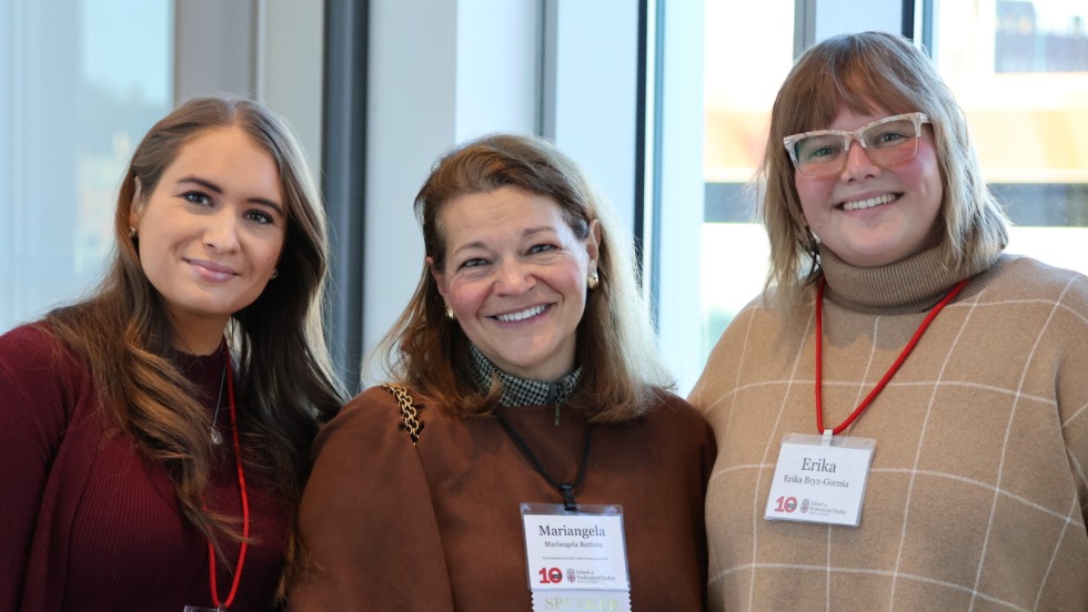 Three women smiling.