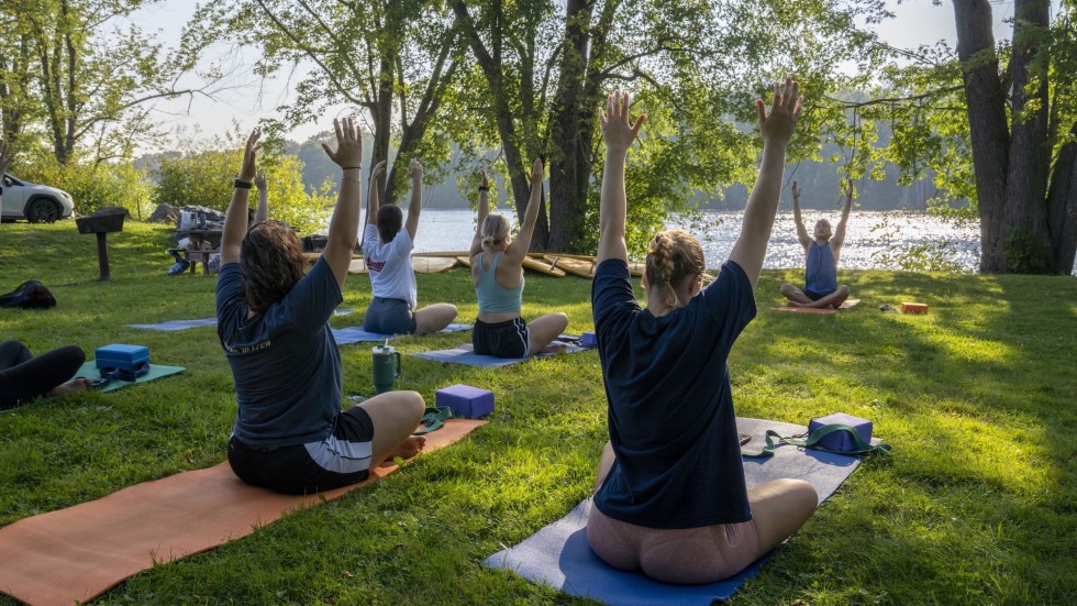 Students meditating outside