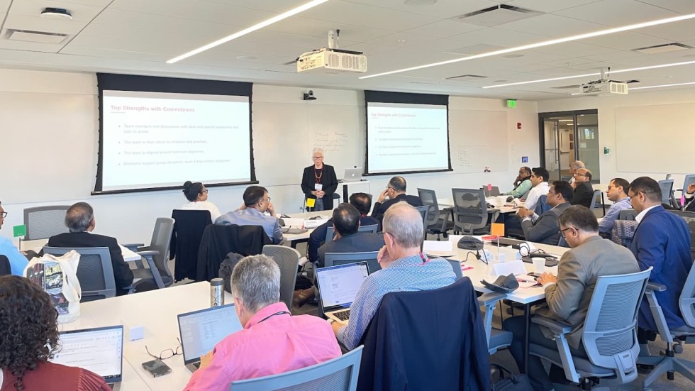 student in a classroom listening to an instructor