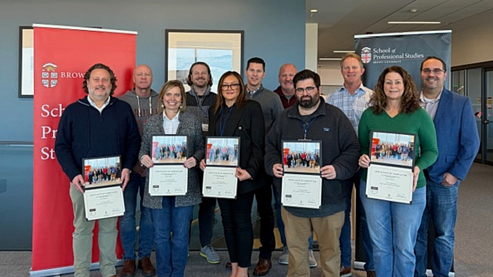 students standing with the certificates 