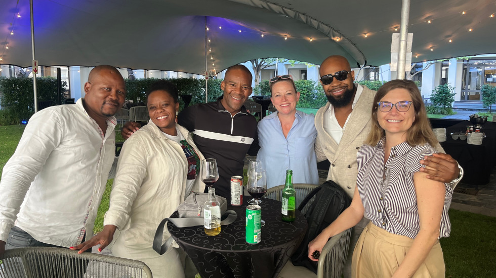 group photo under a tent 