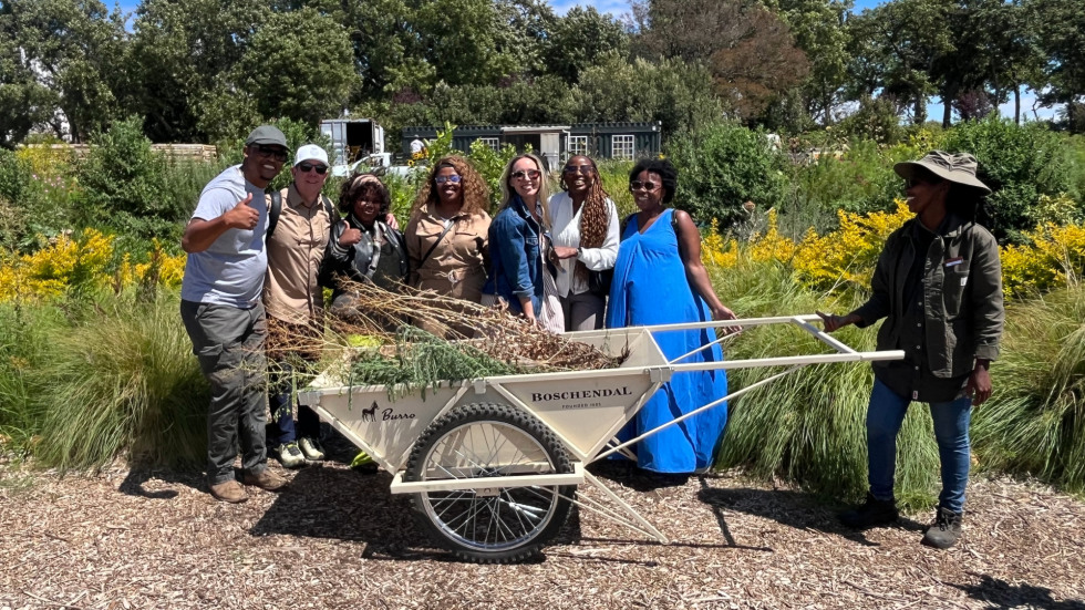 group photo out in the vineyard 